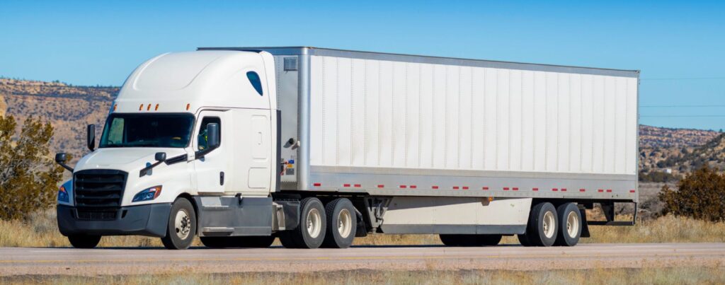 White semi-truck hauling freight on the Arizona to Texas corridor served by a bi-regional 3PL