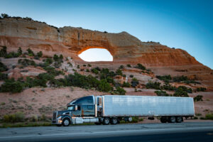 Semi-truck moving Arizona to Texas freight through the Southwest desert via a bi-regional 3PL network