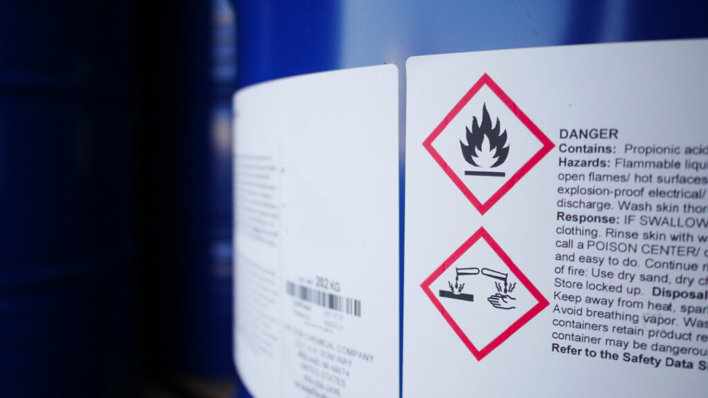 GHS hazard label on drum showing hazmat storage classification requirements